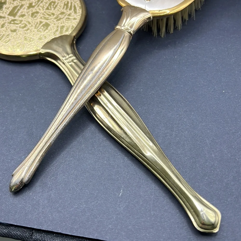 Vintage vanity hand mirror and brush